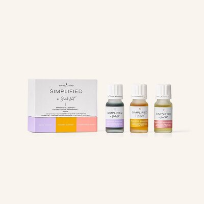 Two bottles of Primally Pure Citrus + Vanilla deodorant on a gray surface