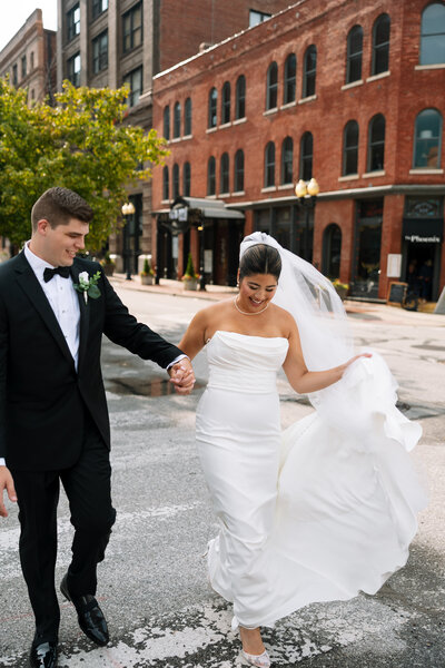 portland, oregon wedding photography, couple walking across the street 