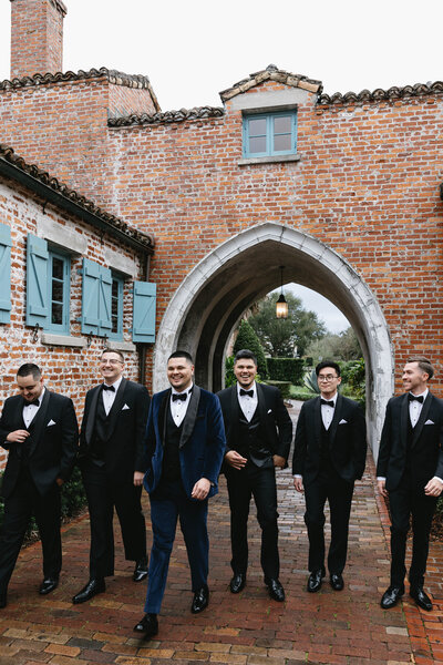 Groomsmen photos standing in a line at Silver Springs National Park in Ocala, Florida