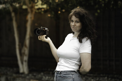 Thistle and Bloom Photography owner poses for camera during a branding session for her business as a Seattle Maternity photographer.