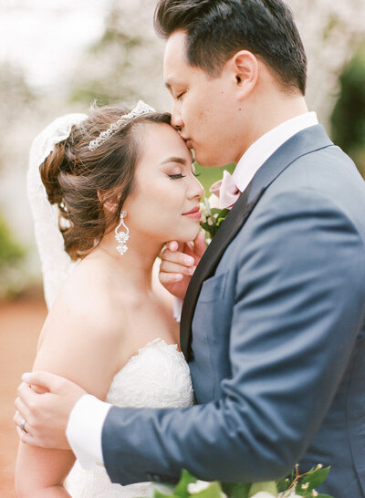 Bride and Groom Kissing at Country Club of the South Wedding Photo