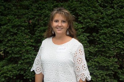 Paralegal Tabatha Jefferies, of McDow & Urquhart LLC, standing outside the Rock Hill, SC courthouse, smiling in a professional portrait.