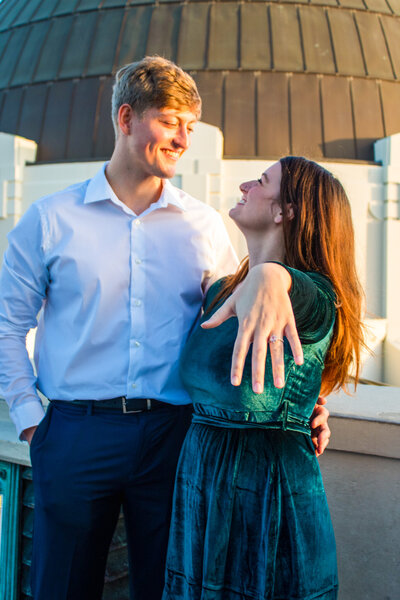 couple lovingly looking at eachother at giffith observatory