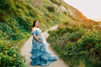 Family posed at maternity session in Seal Beach CA.