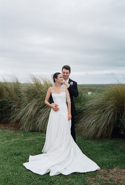 Bride and groom posing for photos by Shelby Ann Photos, wedding photographer jacksonville fl