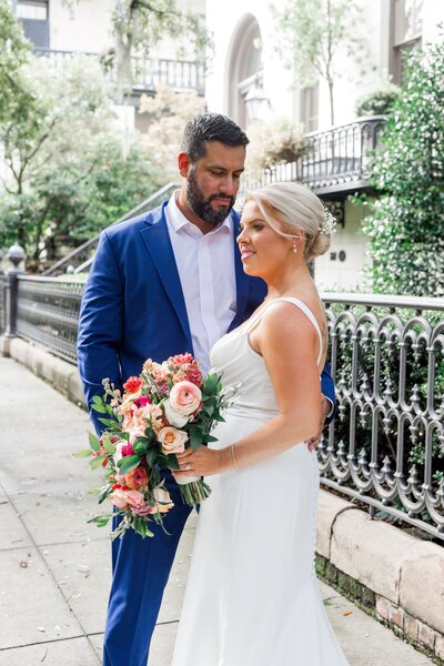 A whimsical portrait of Shannon + Joseph after their elopement ceremony at Reynolds Square in Savannah, captured as part of our Savannah Elopement Package.
