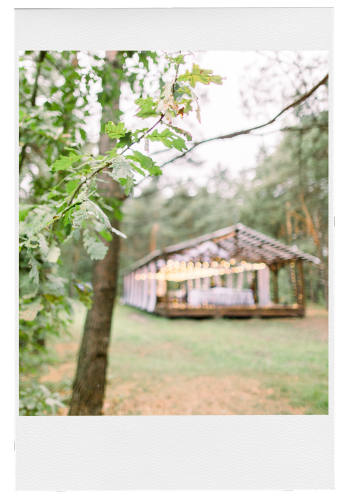 Wedding Venue Polaroid Photo of an outdoor wedding reception pavilion with string lights