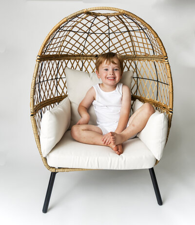 Child in an egg chair