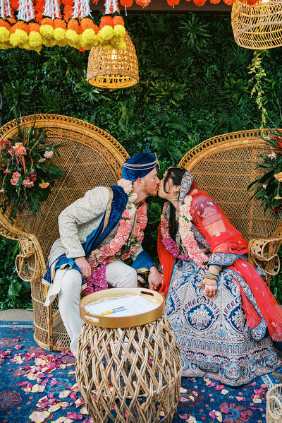 Indian ceremony first kiss on wedding day.