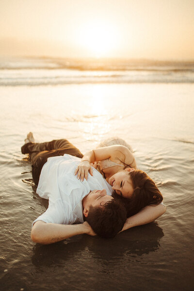 couple laying on the beach