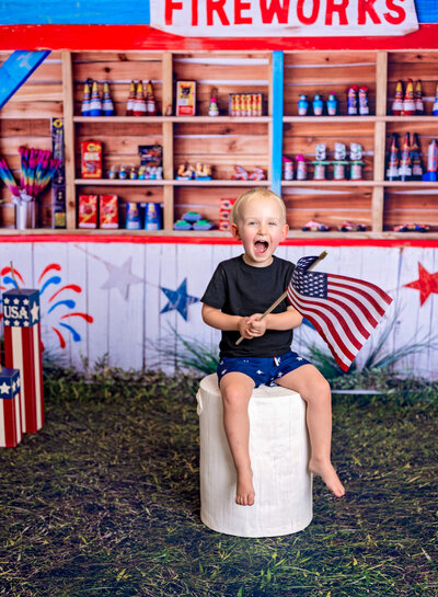Little boy celebrating July 4th in studio with Prescott Arizona photographer Melissa Byrne
