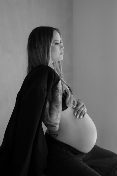mom holding flowers during motherhood session