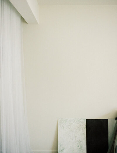 photographer home studio in Detroit, Michigan with white space, sheer curtains, painterly backdrops, film branding photo
