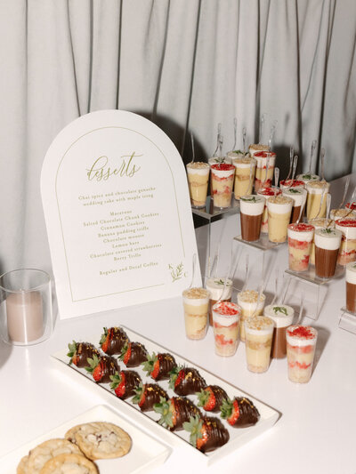 November wedding at Graylyn Estate, designed and planned by Charming Carolina — dessert display featuring dessert shooters, cookies, and a custom dessert sign styled in the reception space.