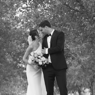 Video thumbnail of Claire and Sam Giammalva’s wedding at Haven on the Farm in Peoria, Illinois, highlighting the intimate outdoor setting, Claire’s radiant bridesmaids, Sam’s dashing groomsmen, and a special moment with Claire’s grandmother serenading the couple during the ceremony.