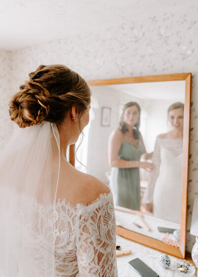 bride looking at her reflection