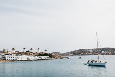 greek island showcasing the sea and windmills