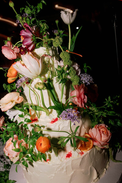 Colorful, vibrant, untraditional wedding cake at Crow's Nest Montauk New York wedding, Lindsey Whatley Photo, East coast documentary-style wedding photographer for the untraditional