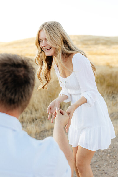 Wedding and Elopement Photographer, couple dancing hand in hand on hillside