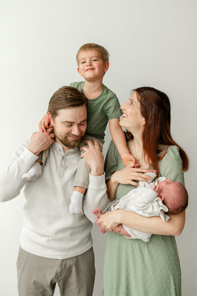 Jessica and her husband playing with their son