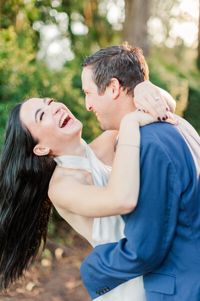 couple laughing in their couples portraits