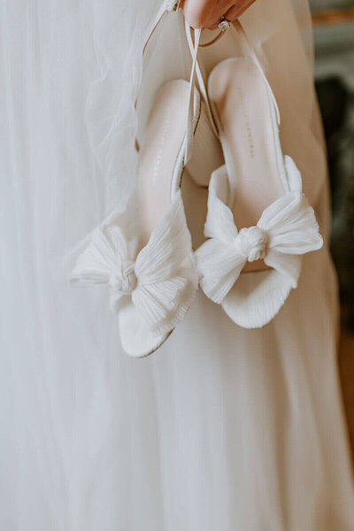 Bride's wedding shoes at The Villa Terrace in Milwaukee by wedding planner milwaukee wi.