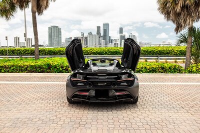 mclaren-720s-spider-convertible-black-for-rent-in-miami-doors-up-rear-view-009