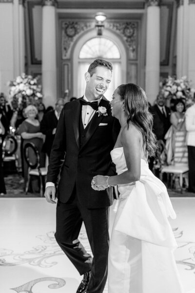 bride in monique lhuillier ballgown with bow on back and hair down