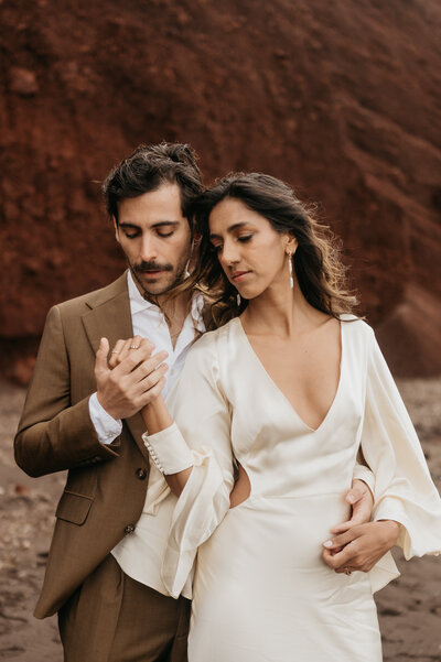 newlyweds in front of vintage car