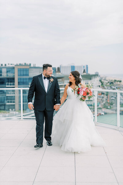 New Jersey wedding couple holding hands at The Wave