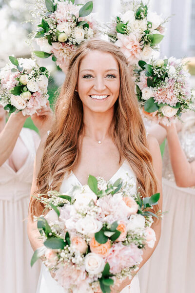 Stunning bridal portrait of a redhead bride holding a bouquet outside of the Delille Cellars wedding venue. Captured by Seattle wedding photographer Luma Weddings.
