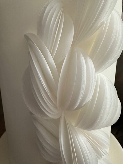 close up look at luxury wedding cake in white 
