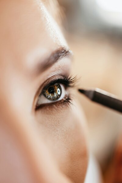 A close up of a person applying eye makeup representing makeup tutorial by Looks with Libby.