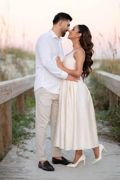 Beach Engagement session with woman in satin dress