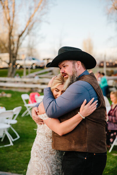 Jackson Hole videographer captures bride hugging father after Jackson Hole wedding