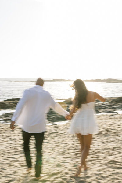 blurry vibe engagement photo on the beach