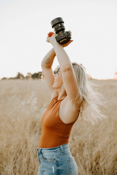 Northern CA photographer dancing in a field