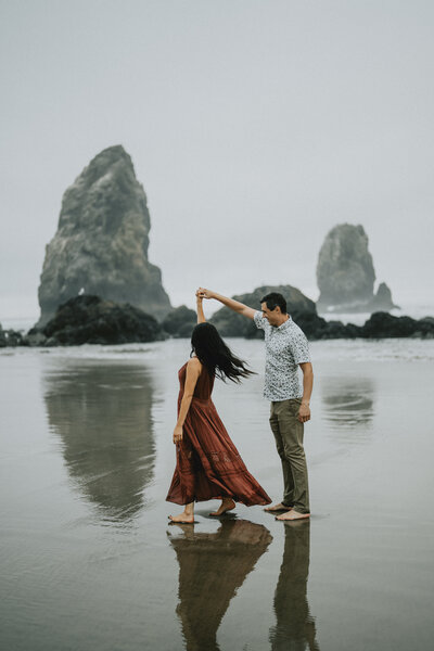 couple at cannon beach engagement