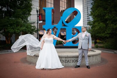 book centerpiece with two orange flowers