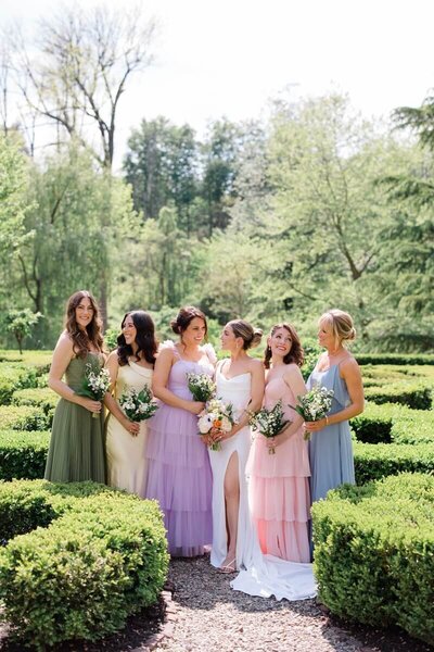 group of bridesmaids in colorful mismatched dresses