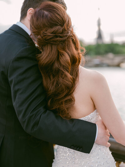 Bride in a bespoke Galia Lahav wedding dress and groom in a black tuxedo at The Arts Club, London, inspired by 90's supermodel style.