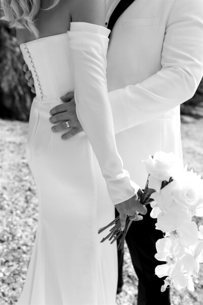 If minimal mastery is on the menu, feast your eyes on Salacea. A draped, scooped neck corset meets a draped, fit and flare skirt. Relaxed detachable sleeves not only bring an effortless to Salacea, but also a second look. Crafted from sleek satin triacetate, KYHA BRIDE 'Salacea' is a study in the contrast between structure and fluidity.
