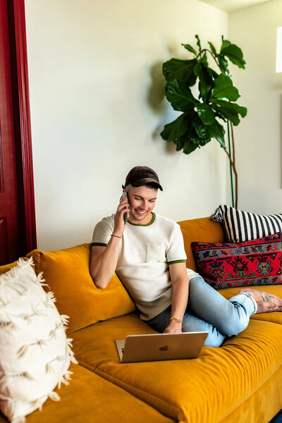Madison Wetter, Cave Creek real estate agent, connecting with a homebuyer over the phone and laptop to understand their preferences and needs.