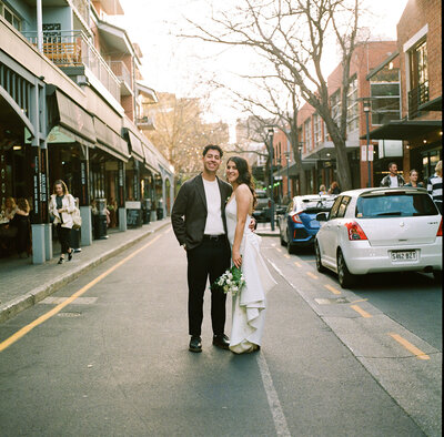bride poses with wine glass on wedding day in adelaide