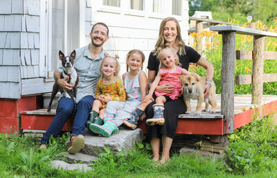 Family sitting on their porch with dogs | Family Photos