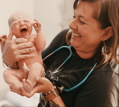 Joni, student midwife at Home Birth Honey, supporting families with gentle, hands-on care.