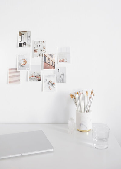 Mood board of photos on a white wall