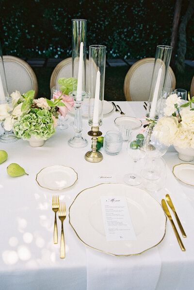bride is pouring champagne into their champagne tower during their colorado wedding day.