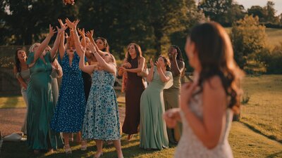 A group of guests catch the Bouquet at a Surrey Wedding