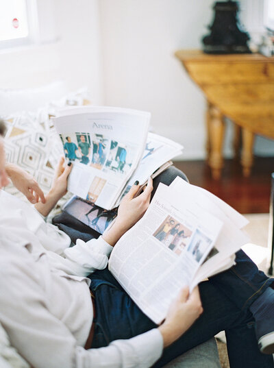 person reading newspaper and waiting for his term to meet dating expert kat